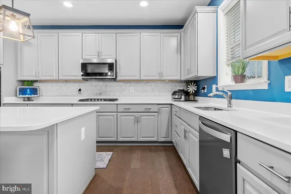 a view of a dining room with furniture and window