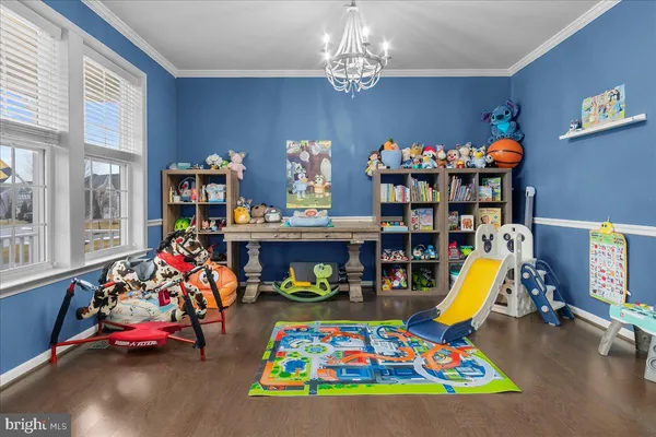 a bathroom with a sink mirror and a toilet