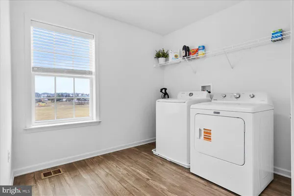 a view of a livingroom with furniture and closet