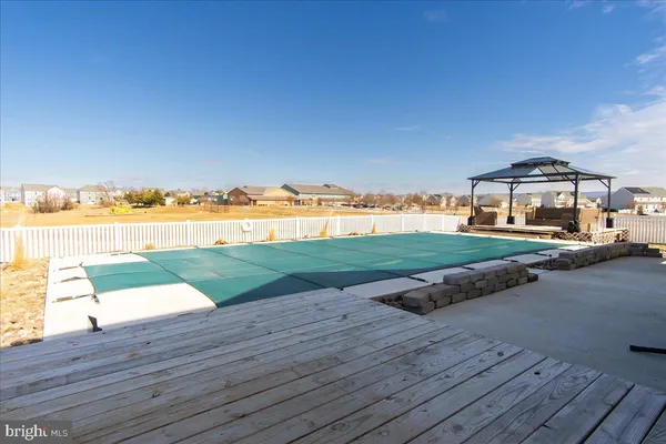 a patio with table and chairs