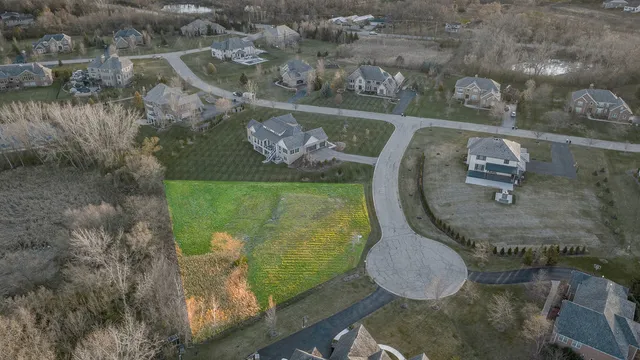 an aerial view of a house with outdoor space