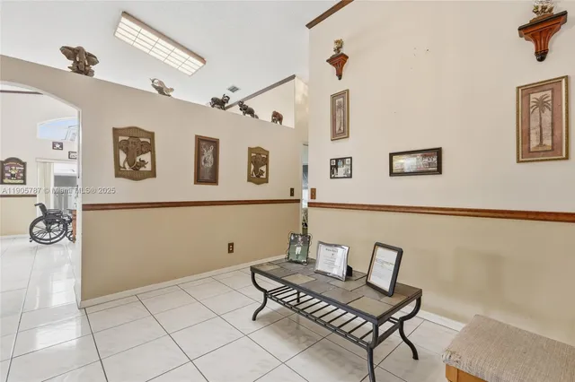 a kitchen with stainless steel appliances a refrigerator and a stove top oven