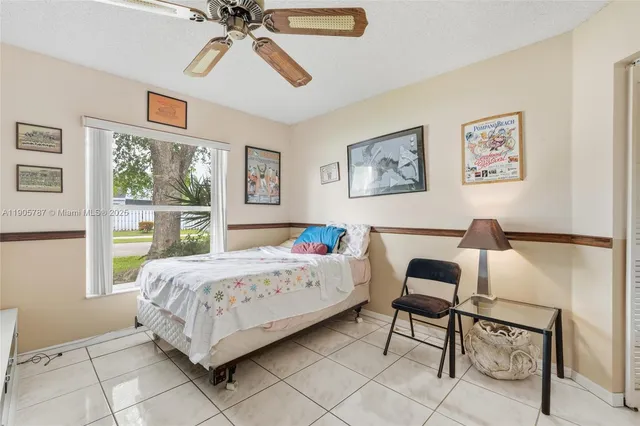 a bathroom with a shower sink vanity and mirror