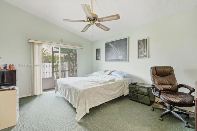 a view of a patio with a table and chairs