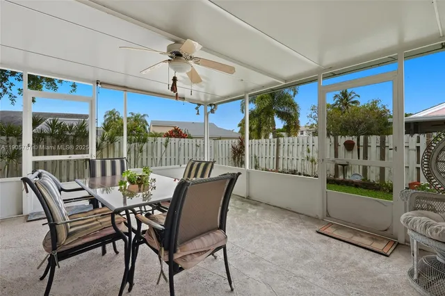 a view of house with backyard and garden