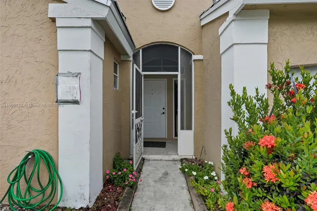a house with a potted plant next to a window