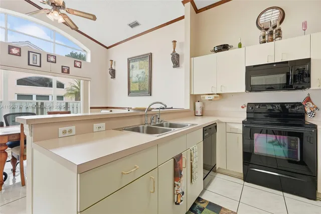 a kitchen with a table and chairs