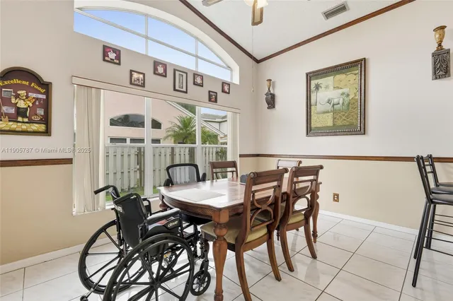 a dining room with furniture and window