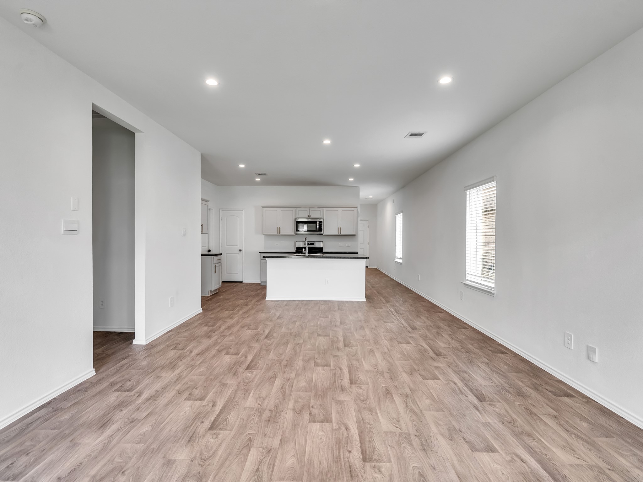 5431 Tuscany Hills Lane Spring, TX 77373 - Photo 21 of 22 a view of a big room with wooden floor and windows