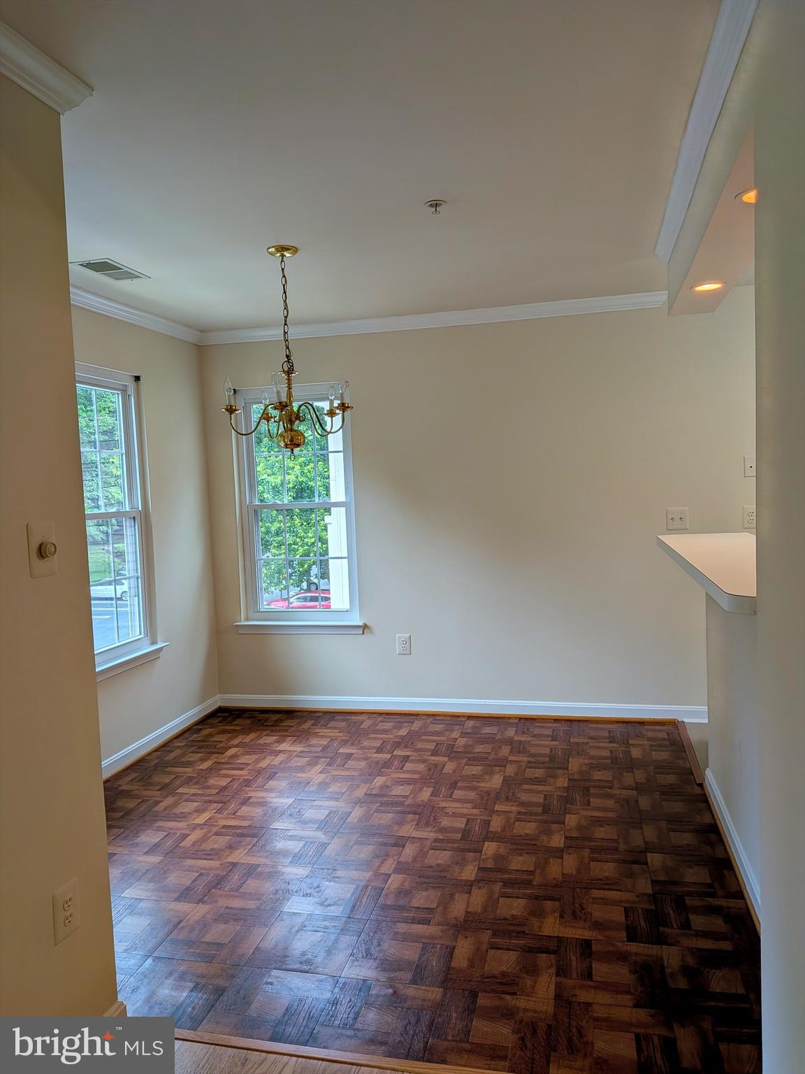 109 Timberbrook Lane, Unit 301 Gaithersburg, MD 20878 - Photo 10 of 22 an empty room with windows and natural light