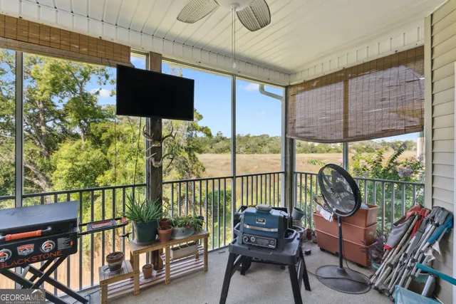 a view of a chairs and table in the balcony