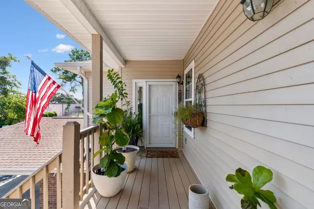 a view of front door and porch with seating space