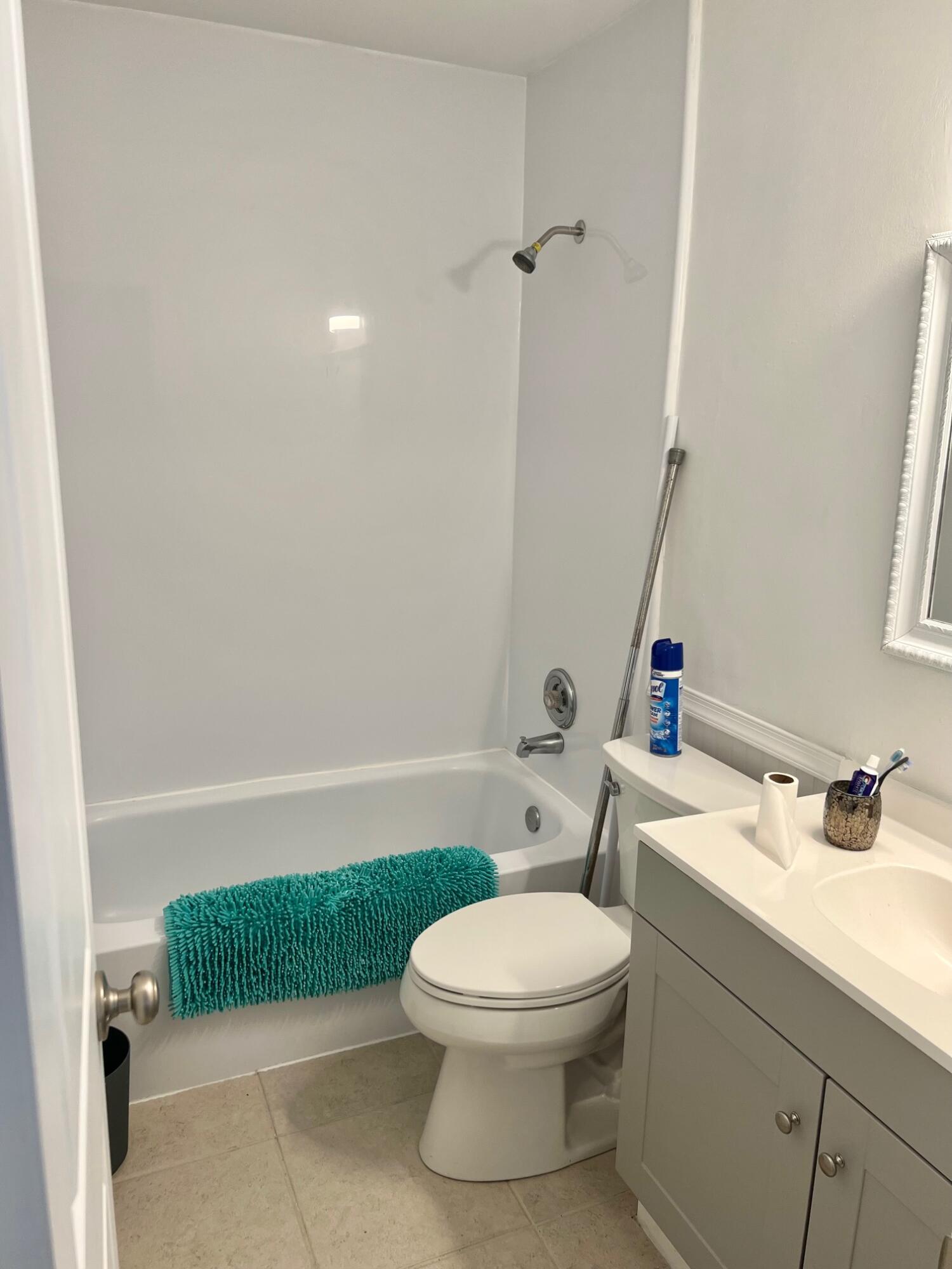 3300 Southeast Fairmont Street Stuart, FL 34997 - Photo 6 of 13 a bathroom with a sink a toilet and tub
