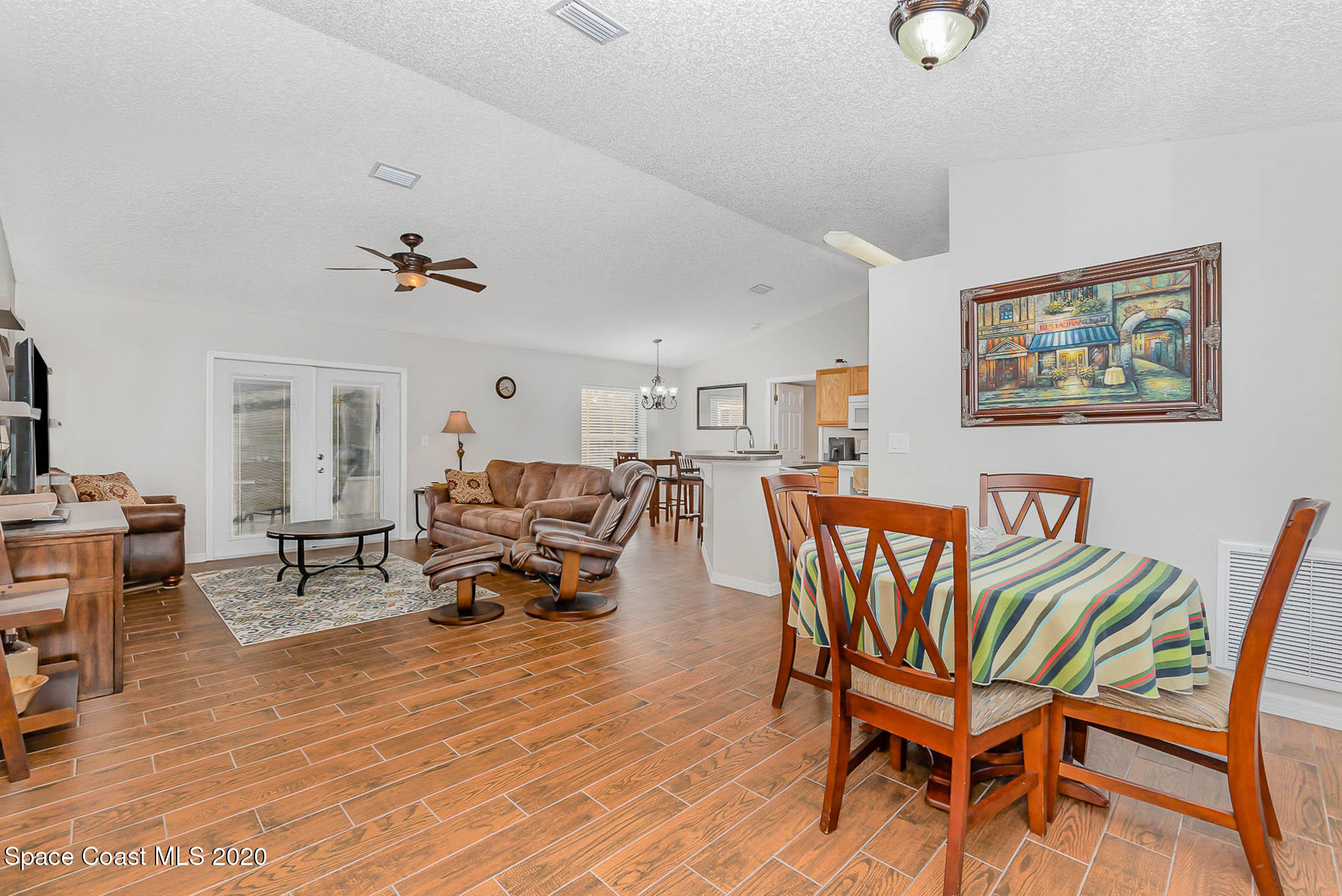 5209 Carrick Road Cocoa, FL 32927 - Photo 2 of 23 a living room with furniture and wooden floor