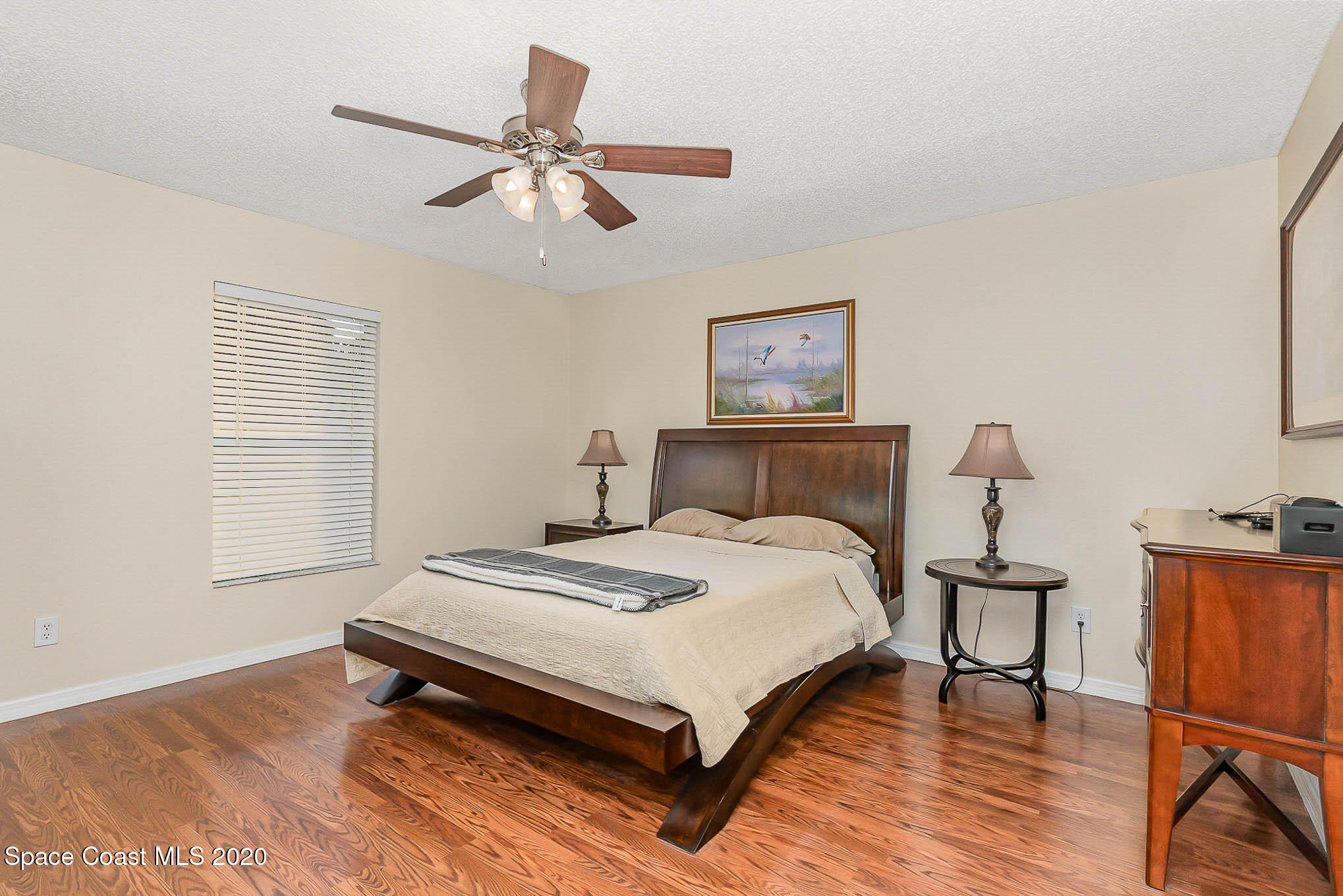 5209 Carrick Road Cocoa, FL 32927 - Photo 11 of 23 a bedroom with a bed and a table