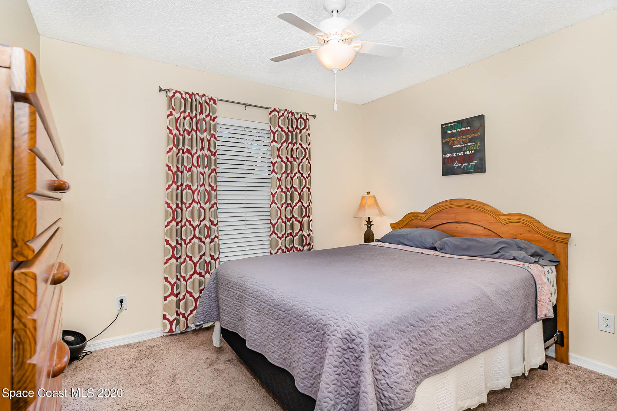 5209 Carrick Road Cocoa, FL 32927 - Photo 14 of 23 a bedroom with a bed and a window