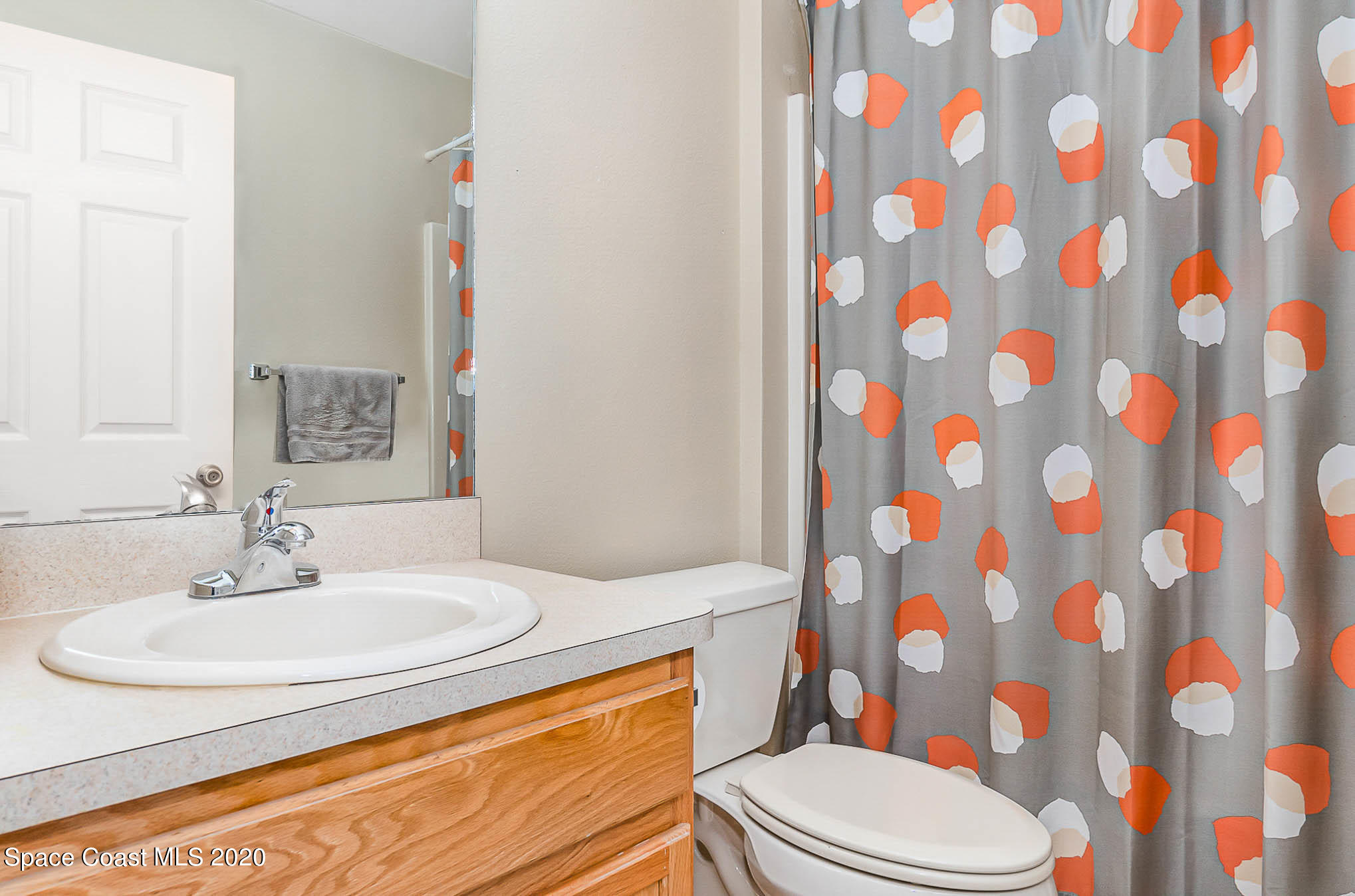 5209 Carrick Road Cocoa, FL 32927 - Photo 15 of 23 a bathroom with a sink toilet and shower