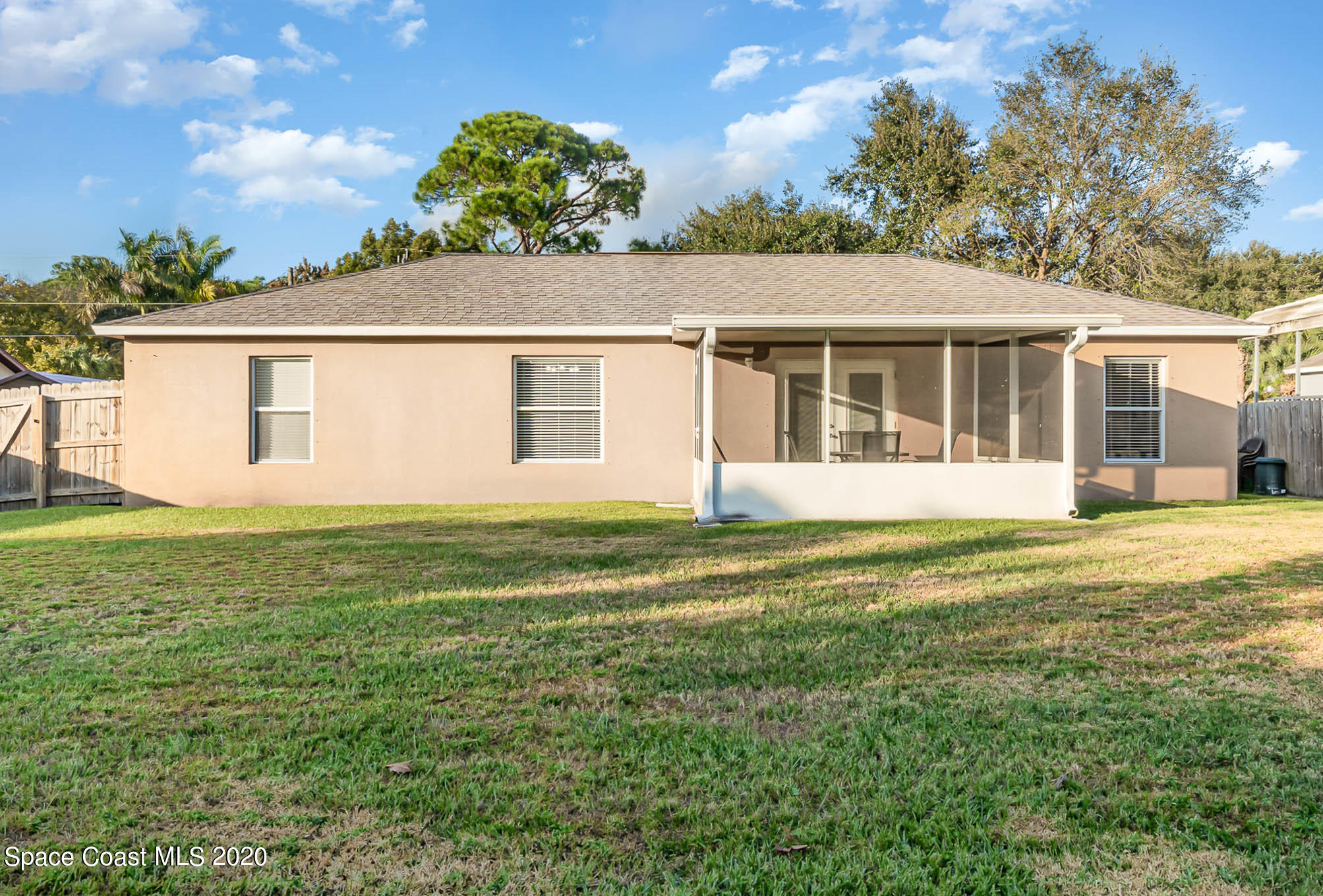 5209 Carrick Road Cocoa, FL 32927 - Photo 18 of 23 a view of a house with a backyard