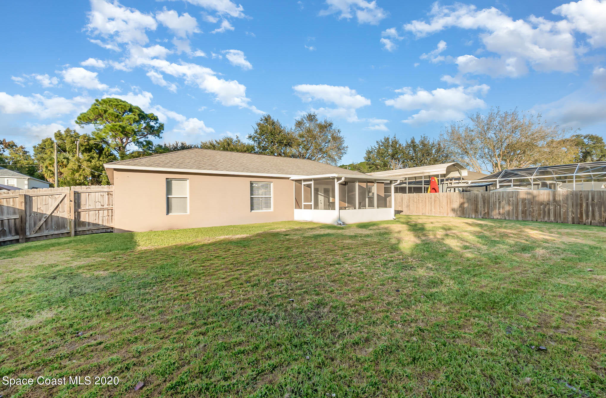 5209 Carrick Road Cocoa, FL 32927 - Photo 19 of 23 a view of a house with a backyard
