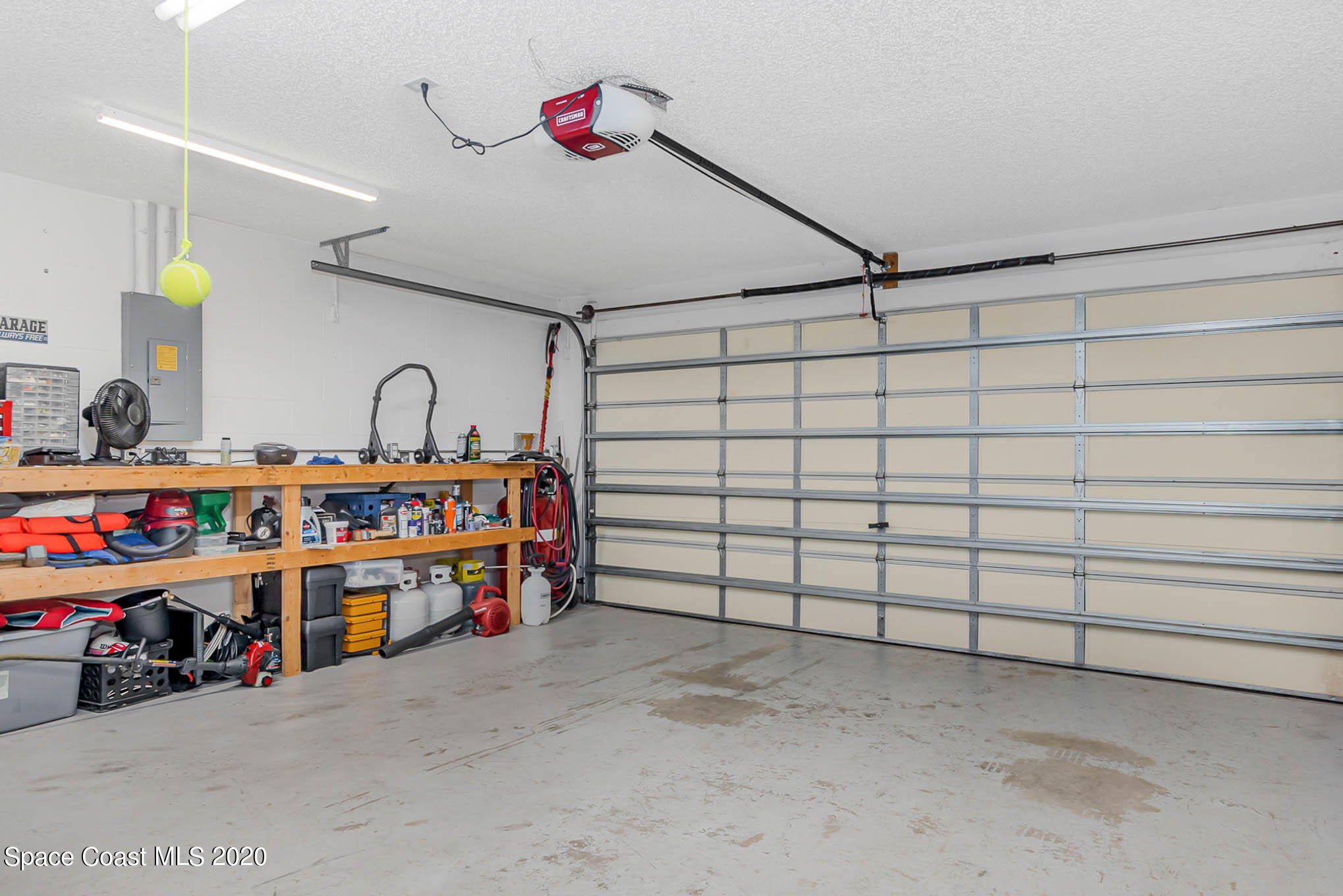 5209 Carrick Road Cocoa, FL 32927 - Photo 21 of 23 a utility room with lots of clutter and toys