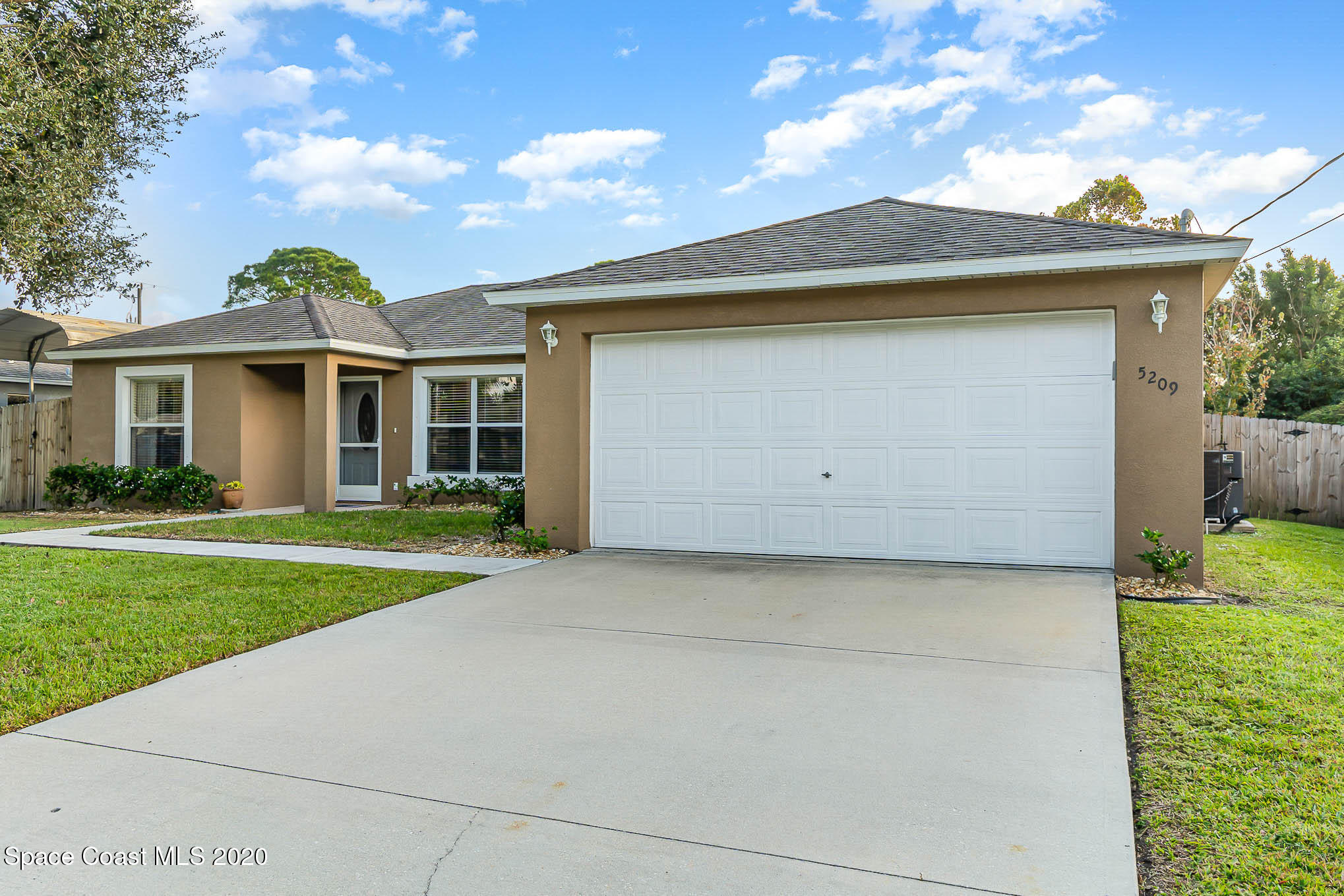 5209 Carrick Road Cocoa, FL 32927 - Photo 22 of 23 a front view of house with yard