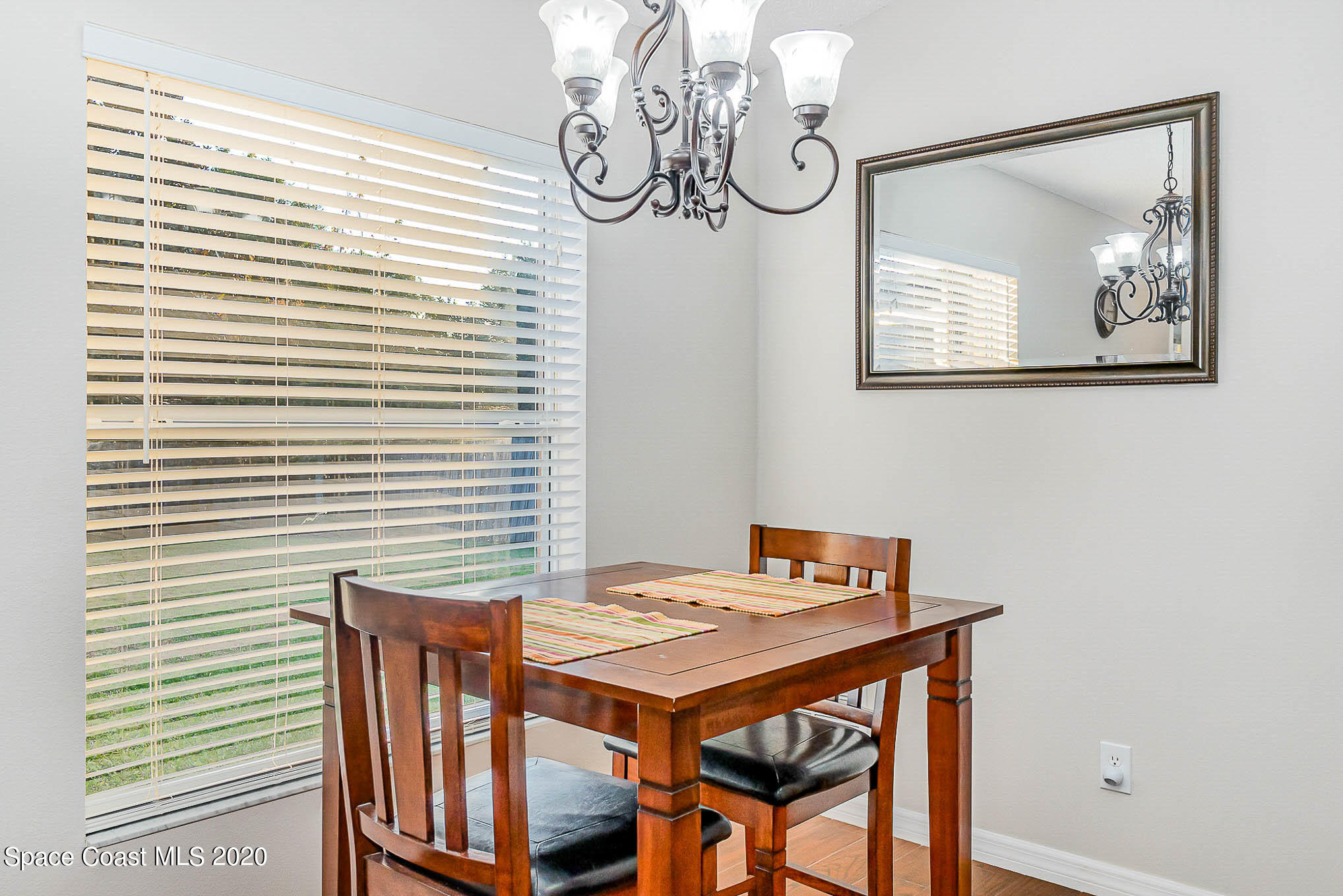 5209 Carrick Road Cocoa, FL 32927 - Photo 6 of 23 a view of a dining room with a table and chairs