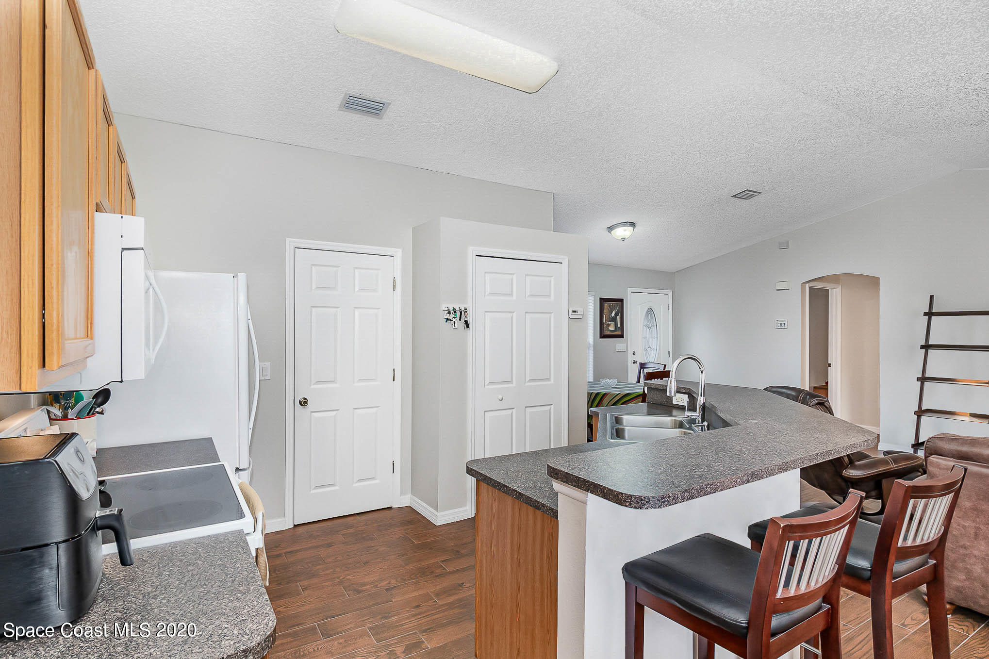 5209 Carrick Road Cocoa, FL 32927 - Photo 9 of 23 a view of a kitchen area with furniture and window