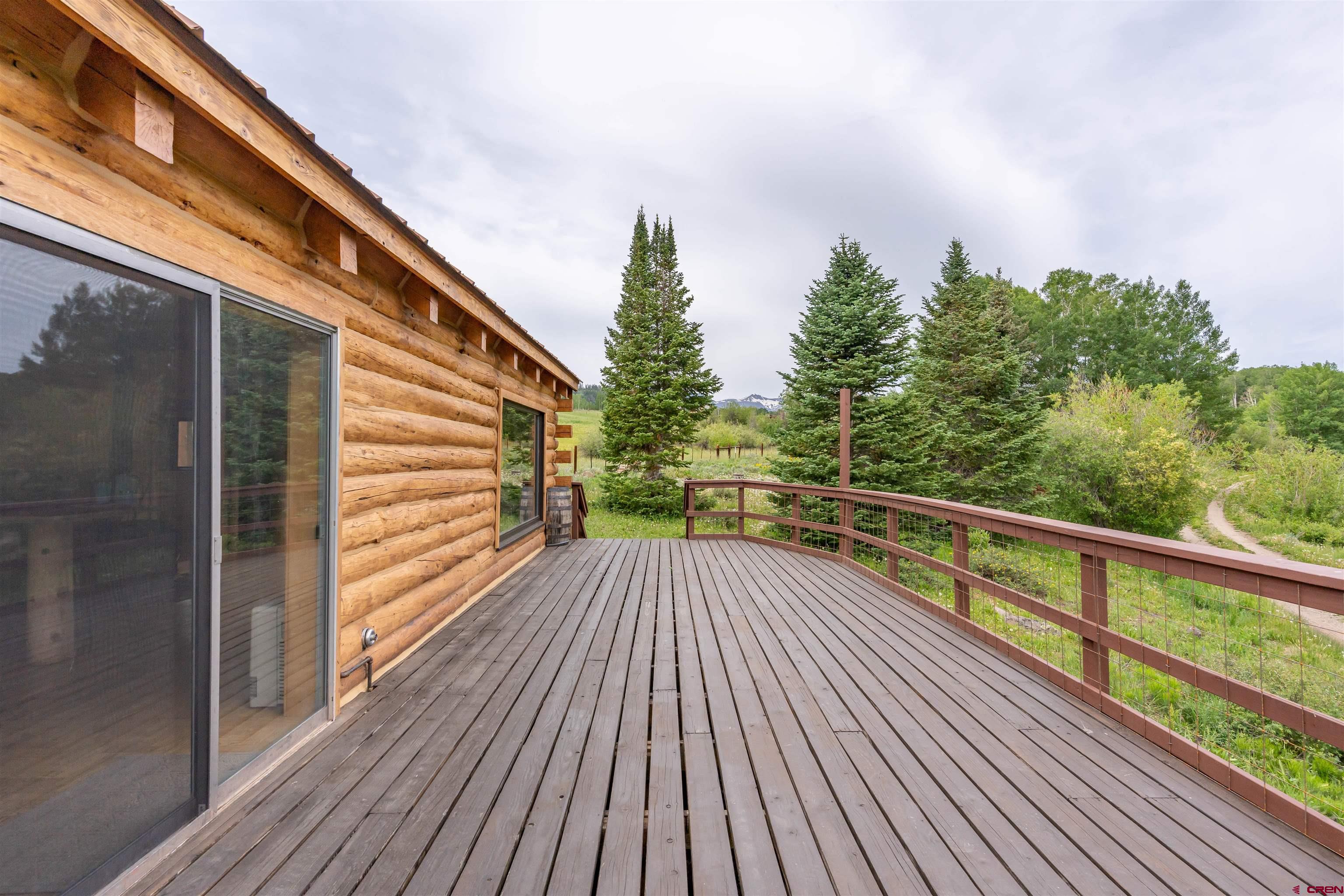 320 Sioux Road Gunnison, CO 81230 - Photo 13 of 35 a view of balcony with wooden floor and fence