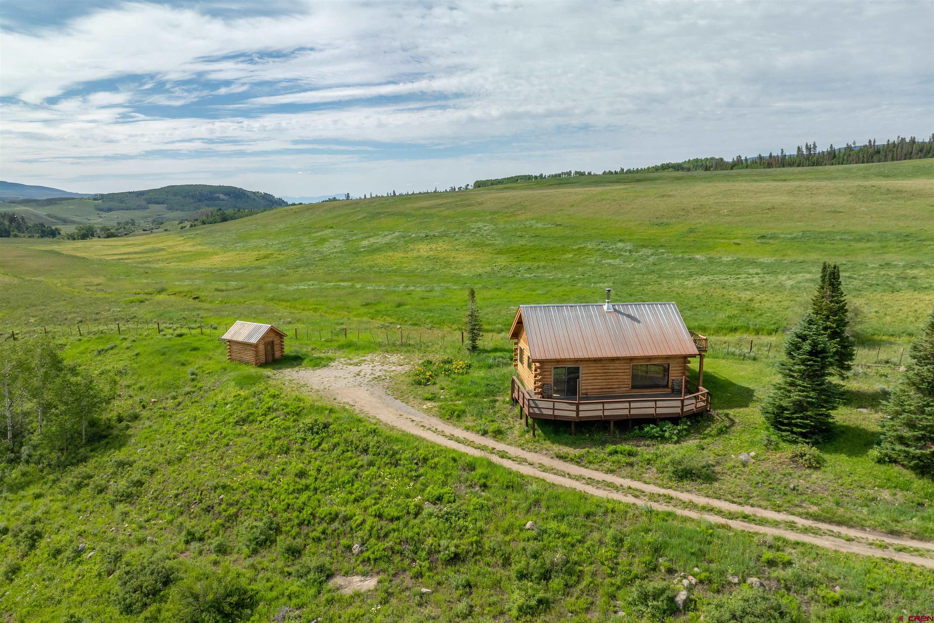 320 Sioux Road Gunnison, CO 81230 - Photo 28 of 35 a view of a lake with a big yard