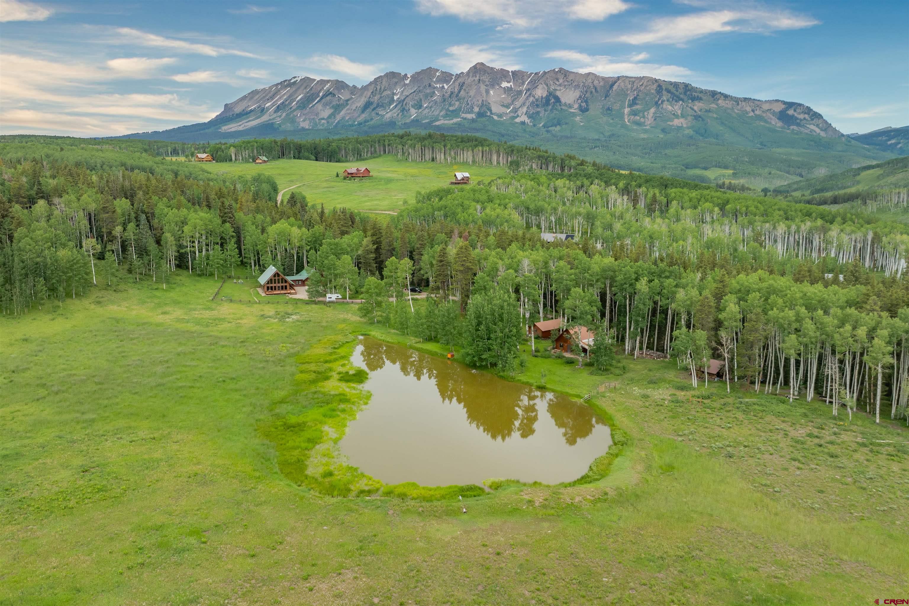 320 Sioux Road Gunnison, CO 81230 - Photo 33 of 35 a view of a lake with a mountain in the background