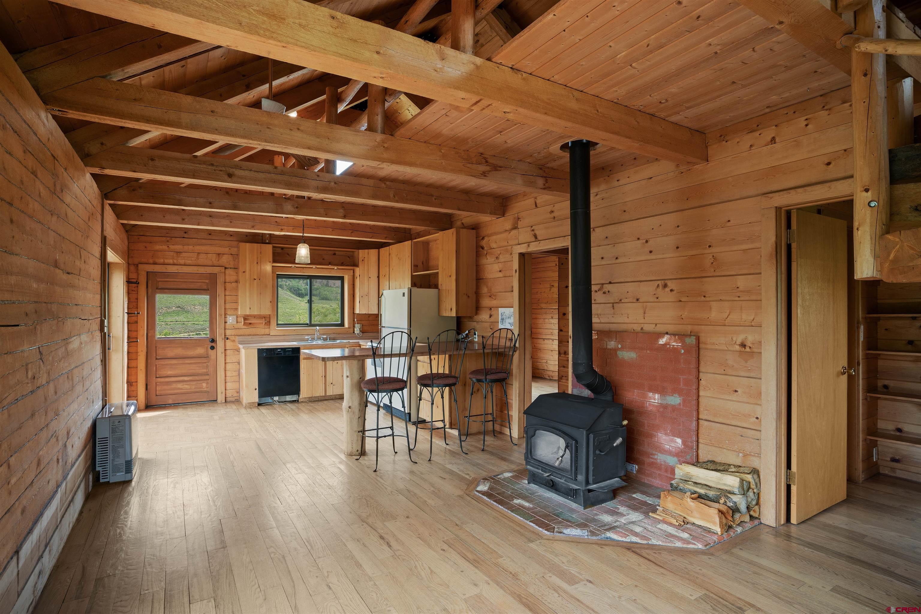 320 Sioux Road Gunnison, CO 81230 - Photo 5 of 35 a dining room with furniture and wooden floor