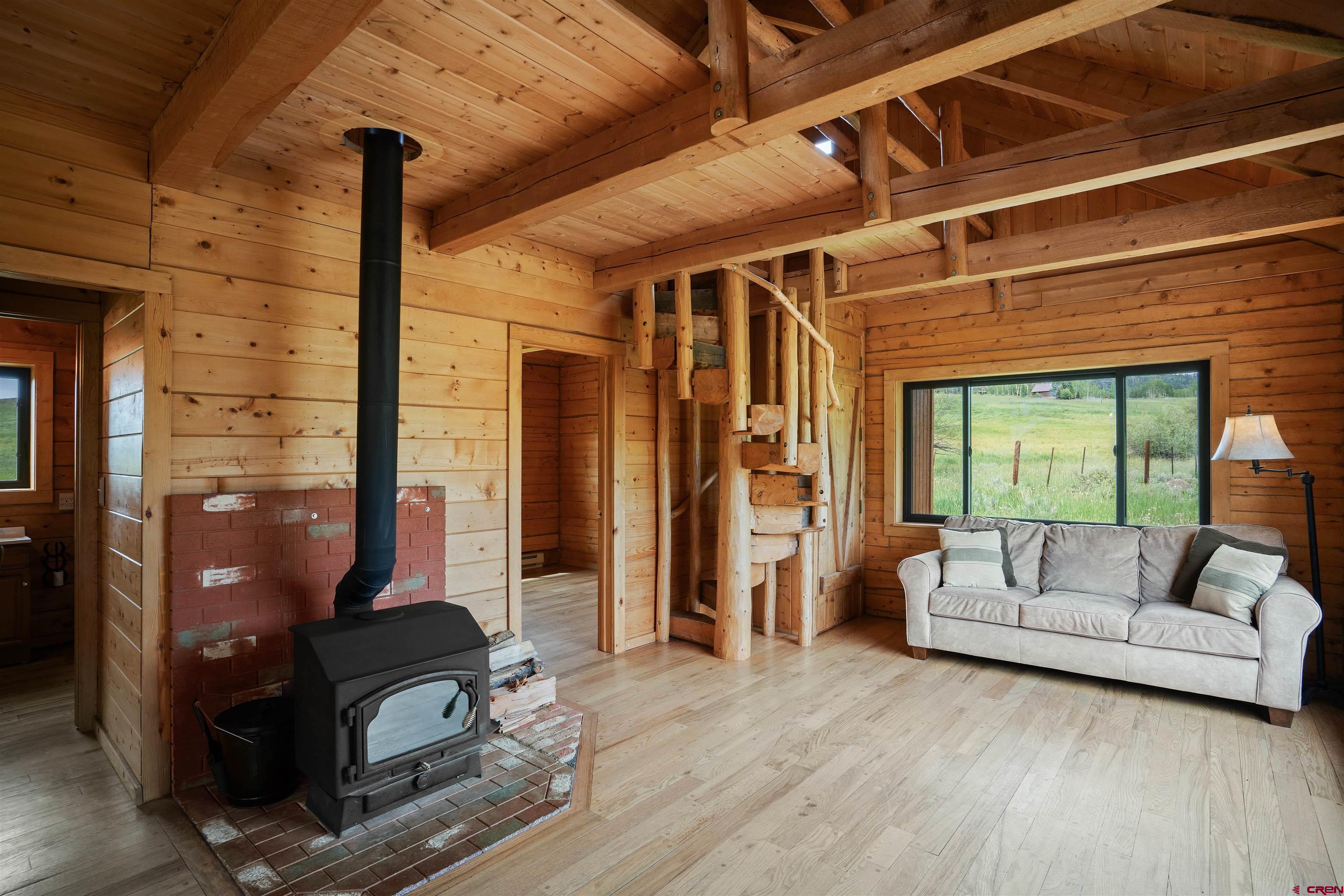 320 Sioux Road Gunnison, CO 81230 - Photo 10 of 35 a living room with furniture and a large window