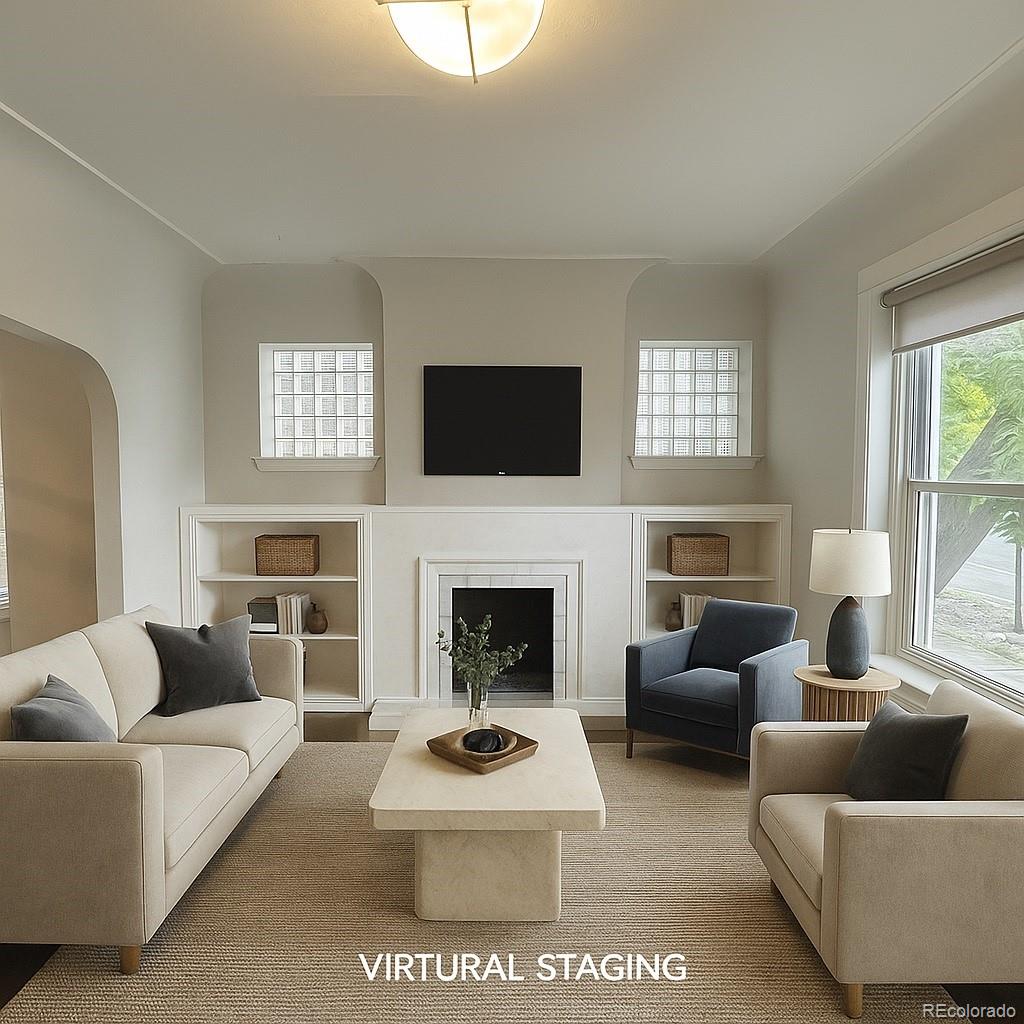 a living room with furniture a fireplace and a flat screen tv