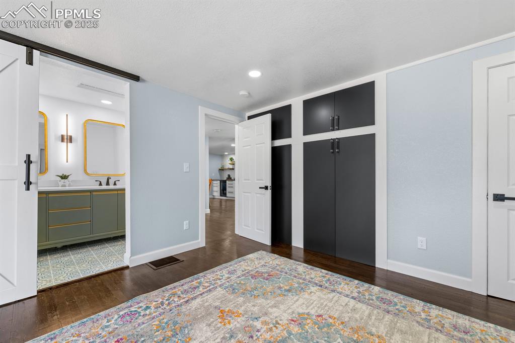 29767 Preston Road Pueblo, CO 81006 - Photo 21 of 46 a bedroom with a bed and a bathroom