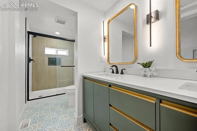 a bathroom with 2 sink and a mirror