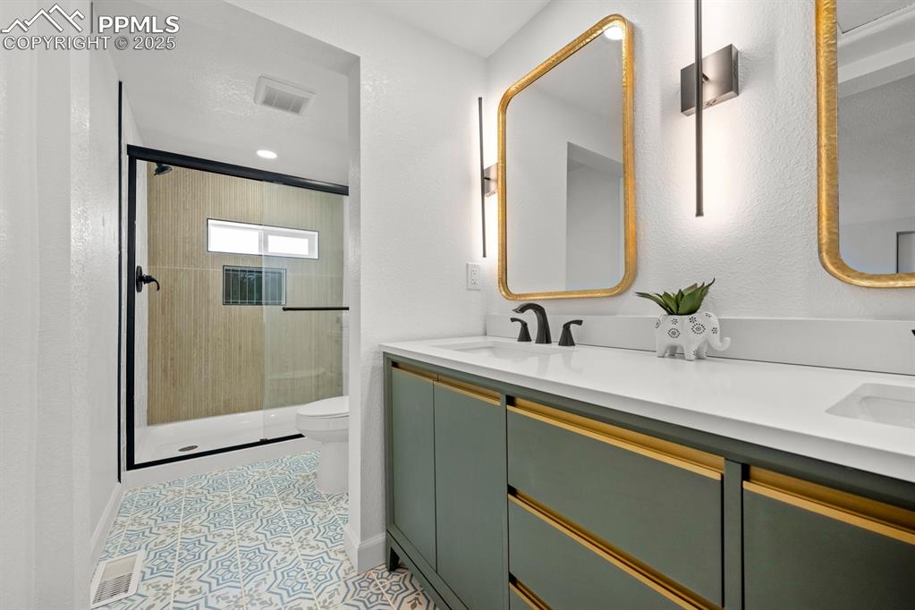 29767 Preston Road Pueblo, CO 81006 - Photo 22 of 46 a bathroom with a sink and mirror