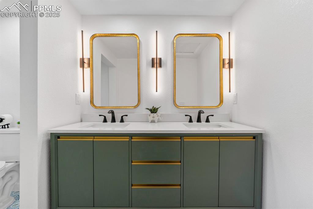 29767 Preston Road Pueblo, CO 81006 - Photo 23 of 46 a bathroom with 2 sink and a mirror