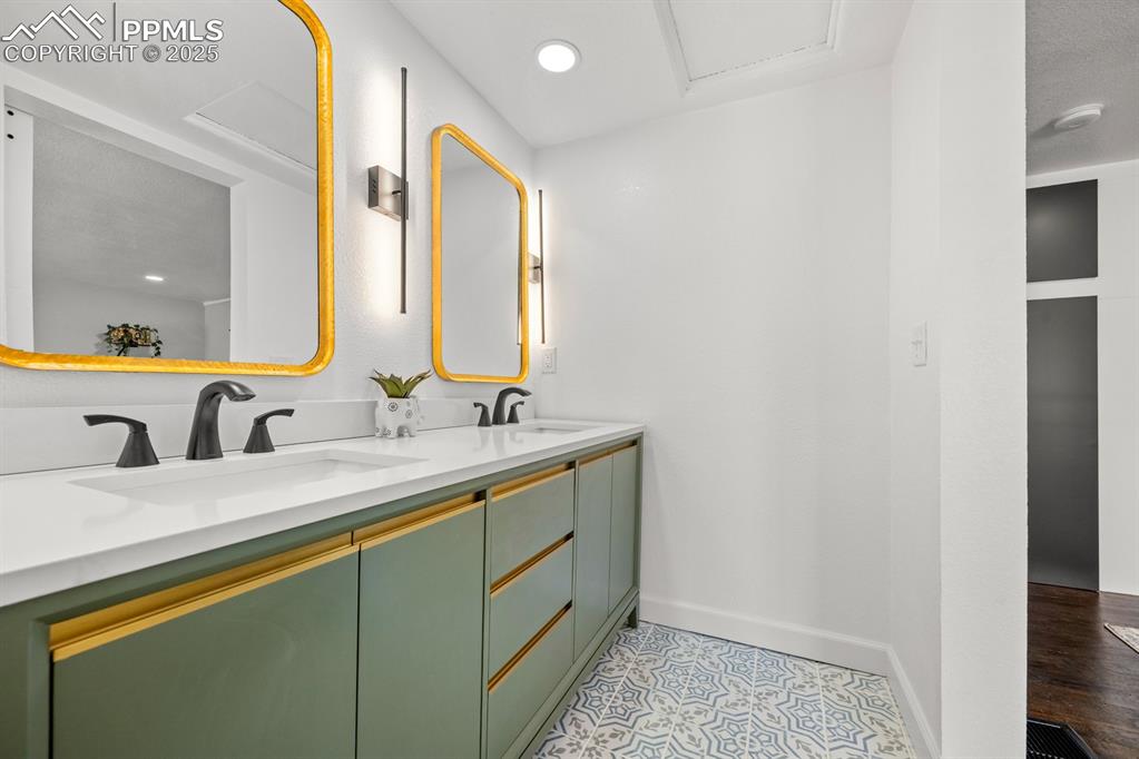 29767 Preston Road Pueblo, CO 81006 - Photo 25 of 46 a bathroom with a sink and a mirror