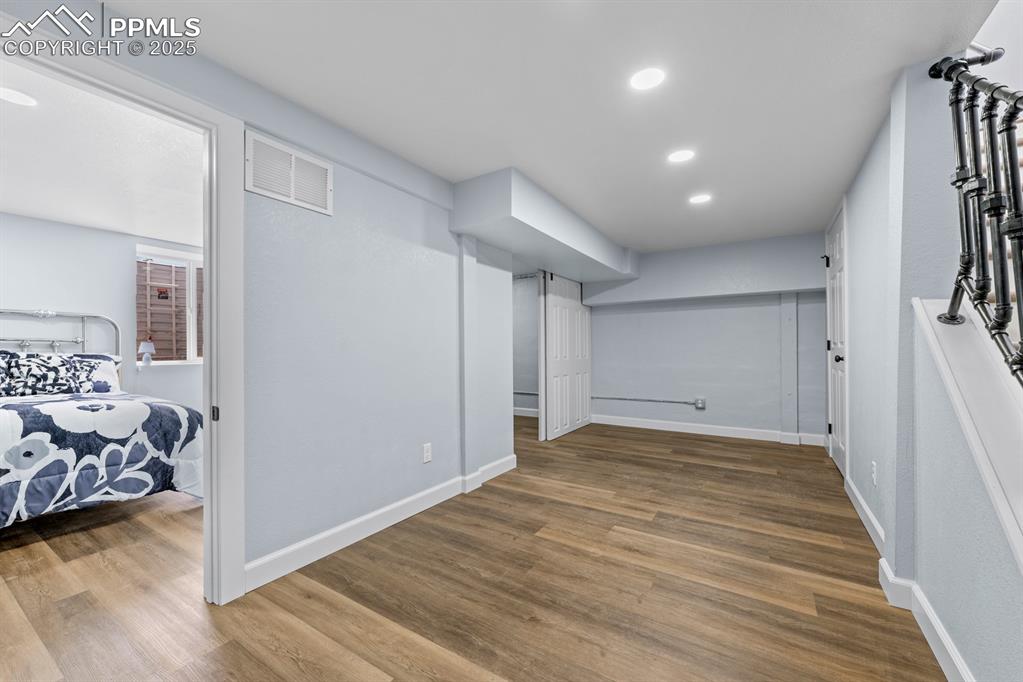 29767 Preston Road Pueblo, CO 81006 - Photo 33 of 46 a view of a livingroom with wooden floor and a ceiling fan