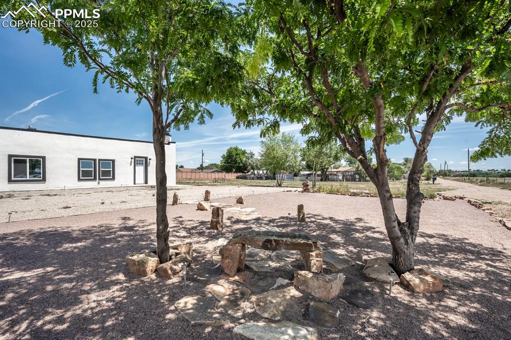 29767 Preston Road Pueblo, CO 81006 - Photo 5 of 46 a view of a yard with a tree