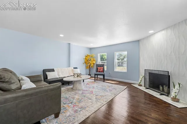 a living room with furniture and a flat screen tv