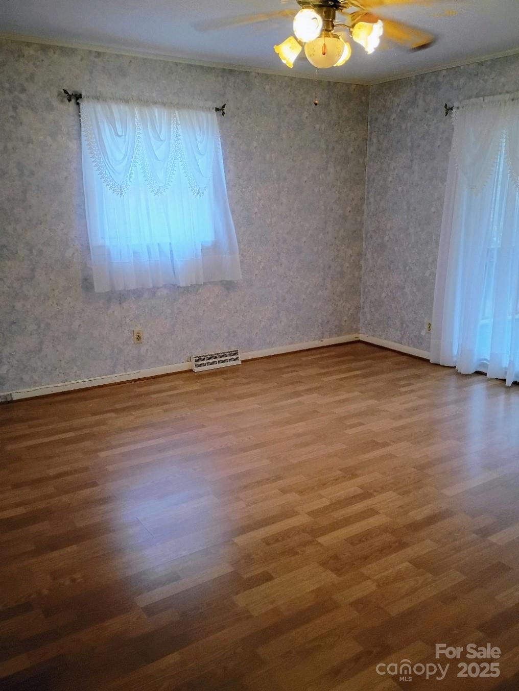 141 Justice Drive Rutherfordton, NC 28139 - Photo 16 of 30 an empty room with wooden floor and windows