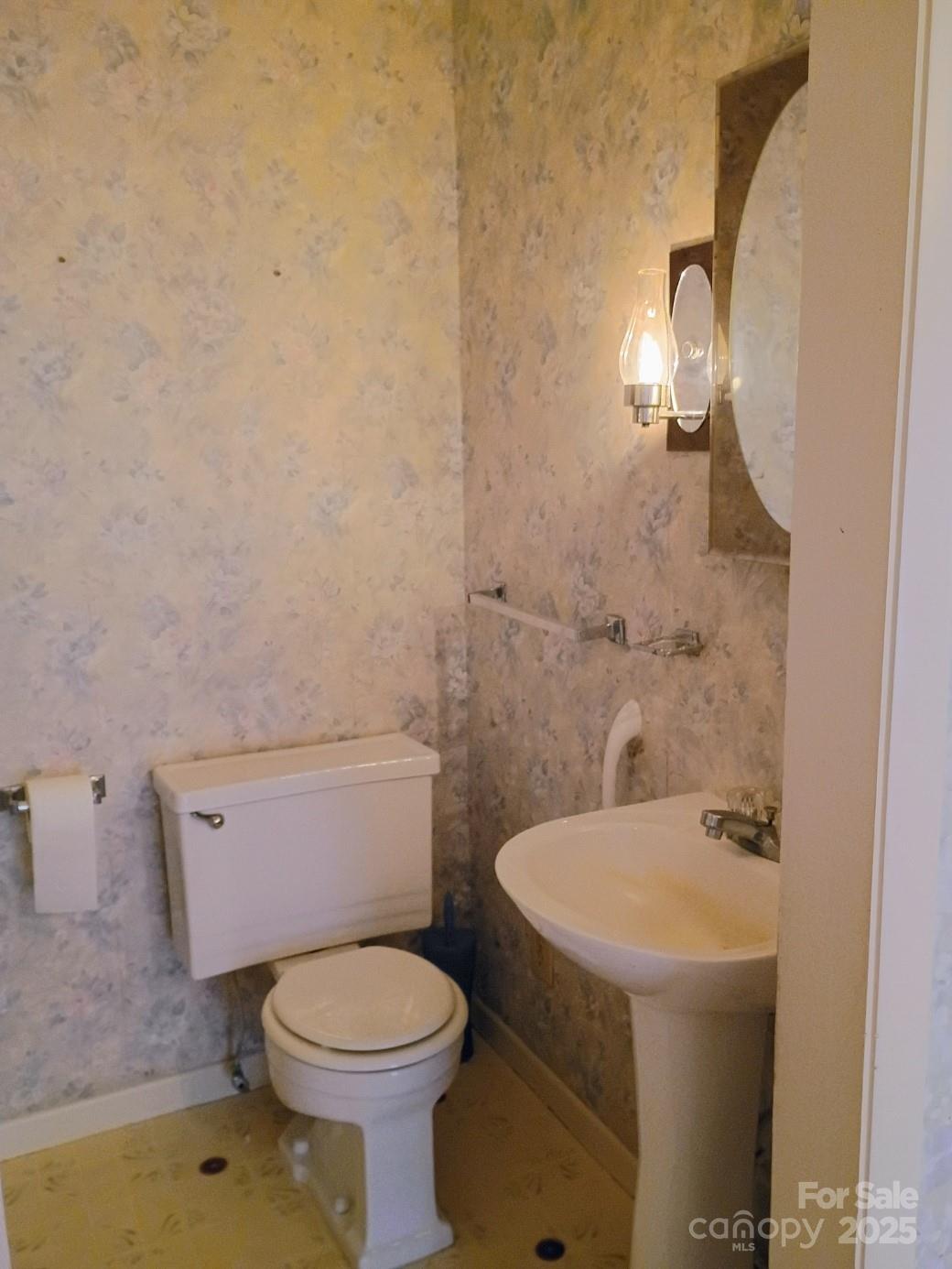 141 Justice Drive Rutherfordton, NC 28139 - Photo 18 of 30 a white toilet sitting next to a bathroom sink