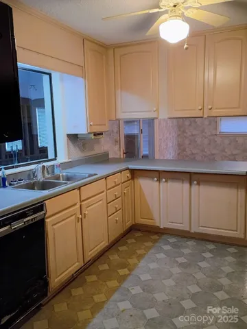 a kitchen with a sink and cabinets