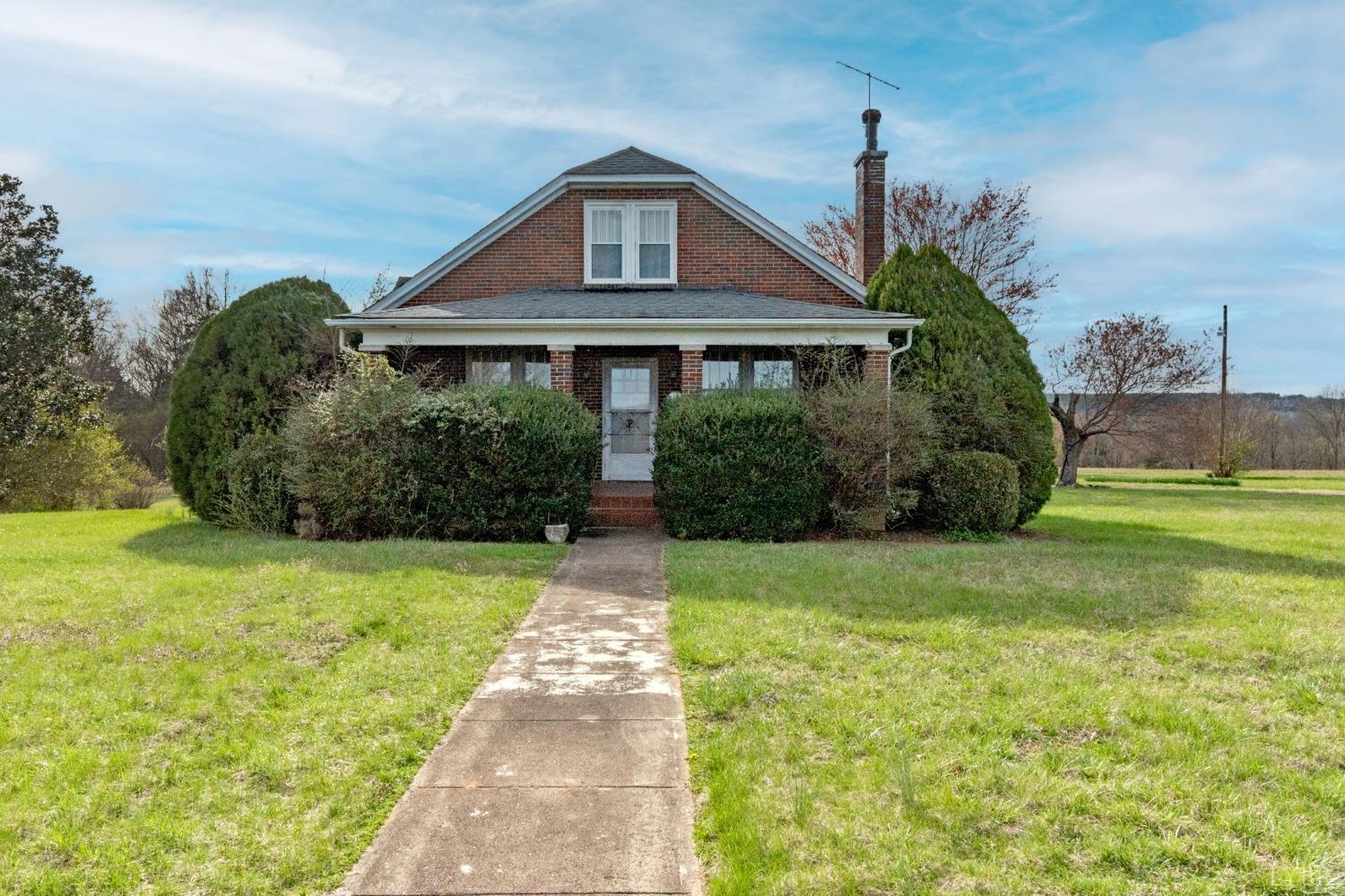 231 Epsons Road Long Island, VA 24569 - Photo 1 of 38 a front view of a house with garden