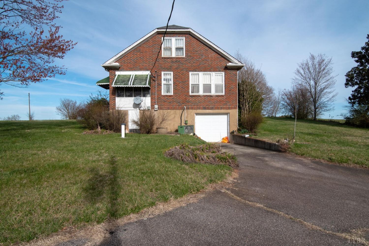 231 Epsons Road Long Island, VA 24569 - Photo 30 of 38 a front view of a house with garden