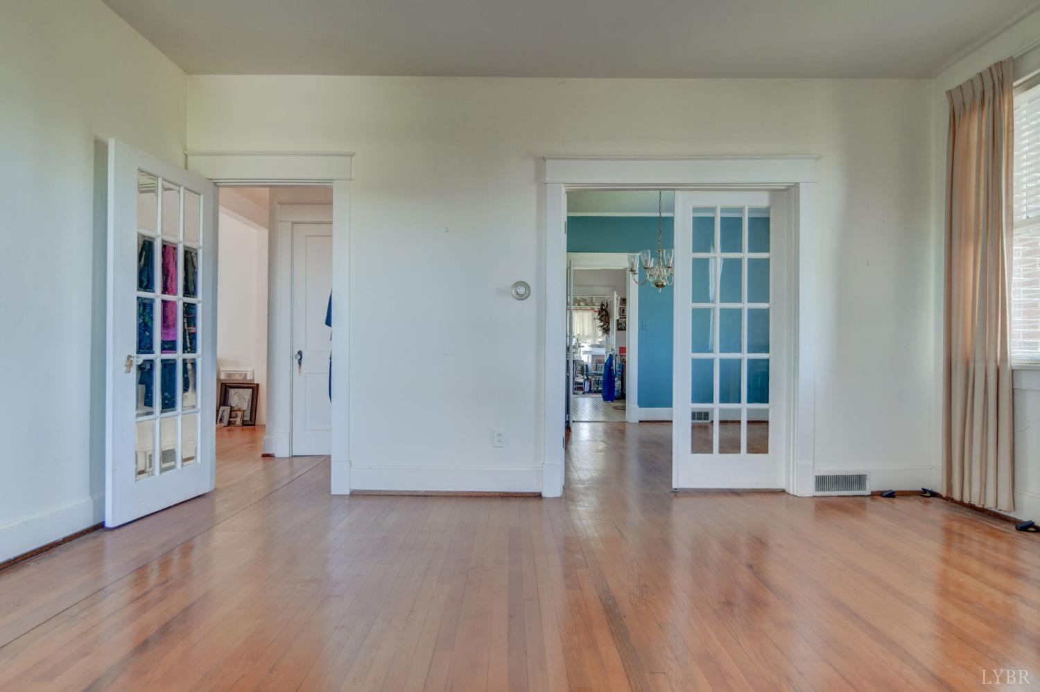 231 Epsons Road Long Island, VA 24569 - Photo 5 of 38 a view of a big room with wooden floor and windows