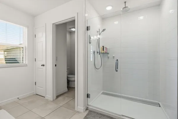 a bedroom with a bed and a closet