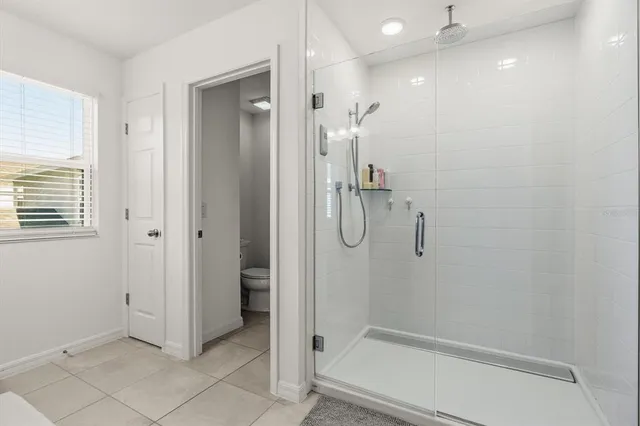 a bedroom with a bed and a closet