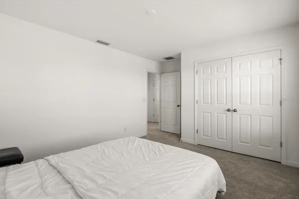 a view of a house with pool and a yard